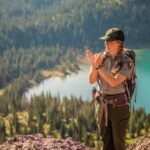 Park Ranger Leading a Hike. GlacierNPS, Public domain, via Wikimedia Commons