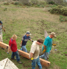 Joseph Haas (red shirt) and his team build a bridge.