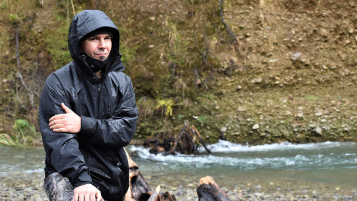 Barry McCovey Jr. wearing a damp raincoat outside.