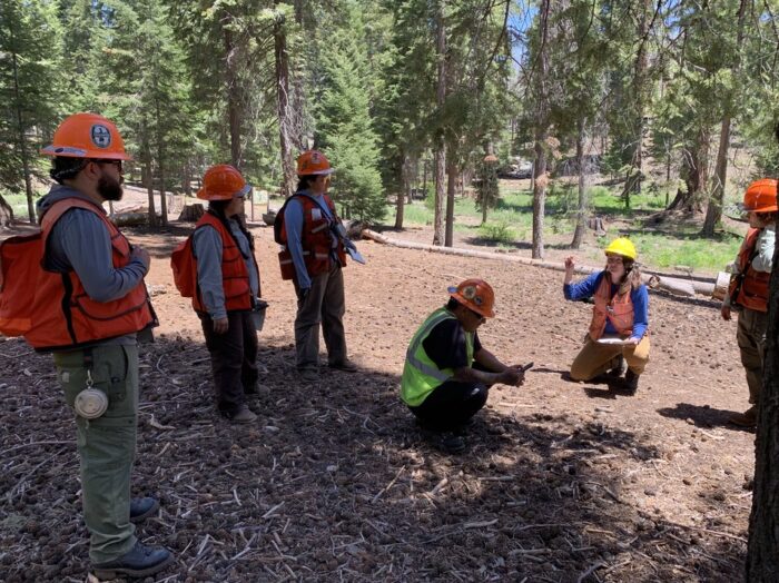 Laura Lalemand in the field with student researchers
