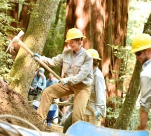 Natalie Oberman swings a mattock to rebuild the River Trail in Humboldt Redwoods State Park. The project was made possible by gifts to the League from The Garden Club of America and members like you.