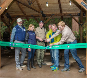 Representatives mark the grand opening of the ramada last year in Portola Redwoods State Park