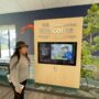 Visitor Rebecca Hurdis uses the Ranch del Oso Welcome Center’s touch screen to learn about wildflower viewing and other recreational activities in Big Basin Redwoods State Park. “I love that the [welcome] center has moved into this new era of art, technology and multimedia,” said Hurdis. Photo by Jennifer Charney, Save the Redwoods League