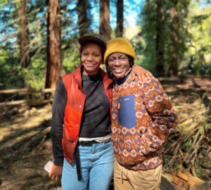  Portrait of two BIPOC people outdoors