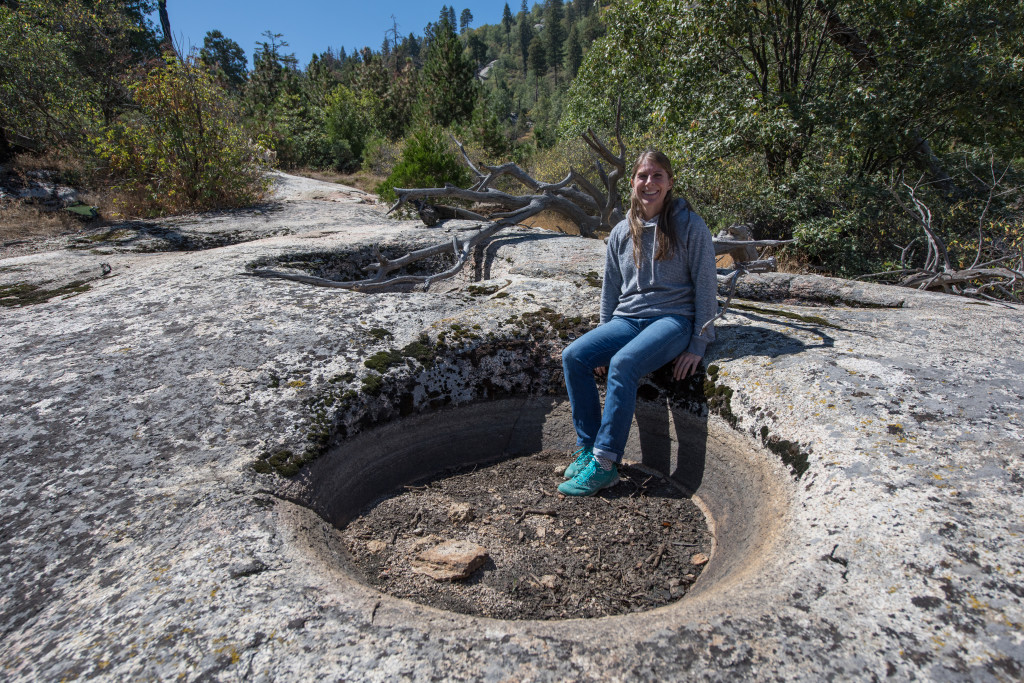 : Case Mountain features granite basins, long believed to have been created by Native Americans. Jessica Neff, the League’s Land Project and Stewardship Manager, tries one on for size.