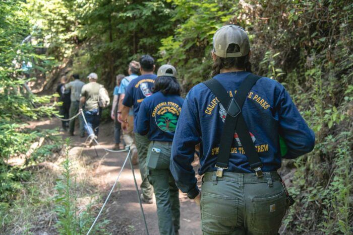 Trail crew walking along the trail