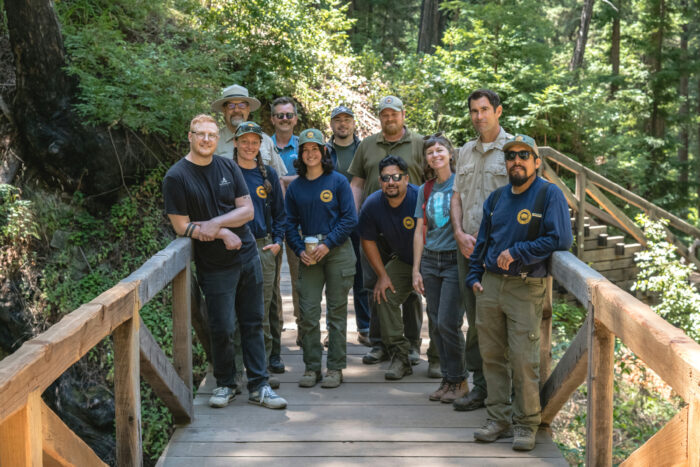 partners standing on finished footbridge
