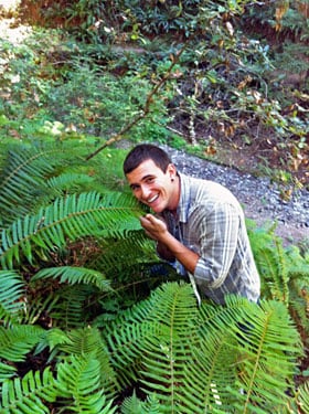Chris Rico takes a moment to enjoy the ferns.
