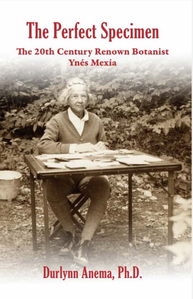 Book cover shows a sepia image of Ynes Mexia, an elderly woman in a cardigan, pants, and hiking boots, sitting at a card table outdoors with papers strewn across the top.