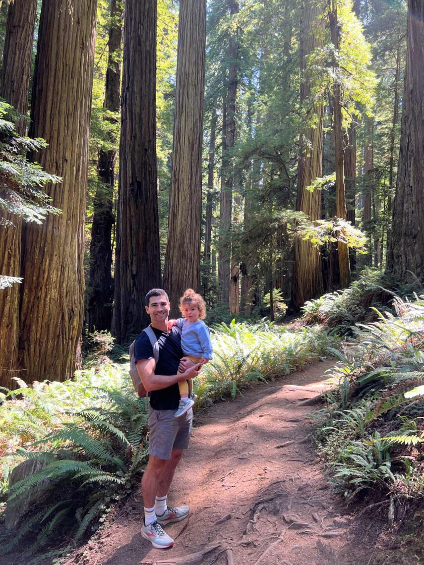 A Jewish man and his daughter in a redwoods forest