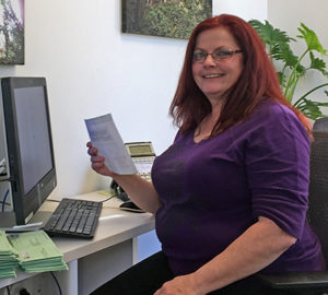 Volunteer Trish VanEyll helps out in the League office.