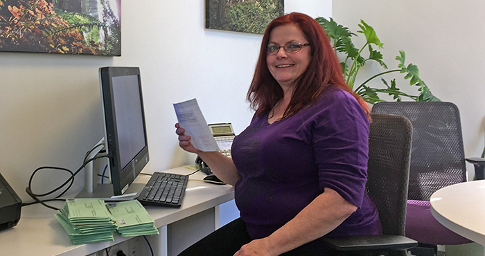 Volunteer Trish VanEyll helps out in the League office.