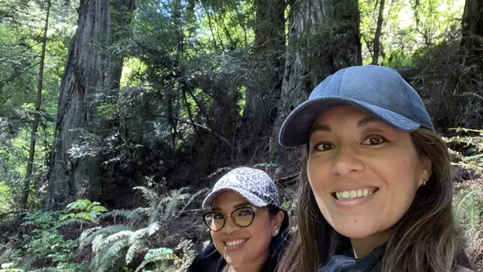 two women outdoors in athletic clothes