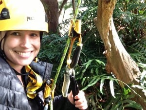 Emily Burns hangs next to a redwood canopy fern mat, 200 feet above the ground.