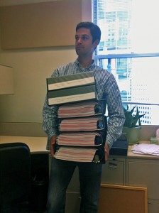 Anthony carrying LTA acrreditation binders.