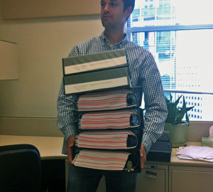 Anthony carrying LTA acrreditation binders.