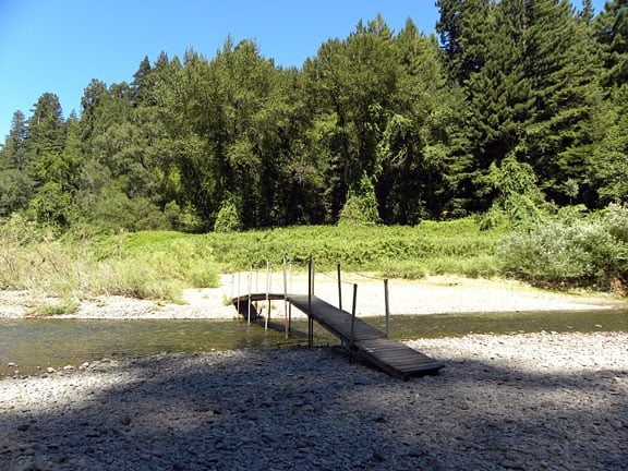 A seasonal footbridge crosses the Eel River from the GCA Day Use Area (shown in the background) to the rest of the GCA Grove.