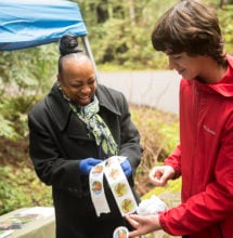 League staffer, Hattie Washington, greets guests at #GreenFriday event at Samuel P. Taylor SP. Photo by Paolo Vescia
