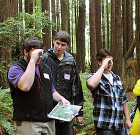 Arcata High School students measure tree height using a clinometer. Your League support enabled them and others to explore forest stewardship careers. Photo by The Forest Foundation