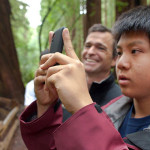 Young students (like the one above with Sam Hodder, League President and CEO) joined the League and other organizations at last spring's BioBlitz to inventory plant and animal species in Muir Woods National Monument. Your gifts support such League projects to introduce new generations to the wonder of the redwoods, improving their health and well-being as they learn about the forest. Photo by Tonatiuh Trejo-Cantwell