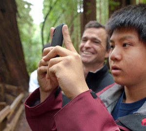 Young students (like the one above with Sam Hodder, League President and CEO) joined the League and other organizations at last spring's BioBlitz to inventory plant and animal species in Muir Woods National Monument. Your gifts support such League projects to introduce new generations to the wonder of the redwoods, improving their health and well-being as they learn about the forest. Photo by Tonatiuh Trejo-Cantwell