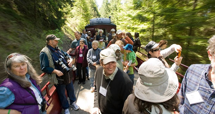 Your gifts helped to repair a collapsed railroad tunnel that shut down the Skunk Train's famous Redwood Route to the Noyo River Redwoods, which you protected. Smiles have returned to riders' faces, as in this 2011 image. Photo by Paolo Vescia.