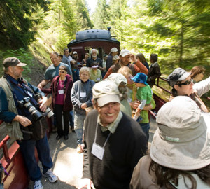 Your gifts helped to repair a collapsed railroad tunnel that shut down the Skunk Train's famous Redwood Route to the Noyo River Redwoods, which you protected. Smiles have returned to riders' faces, as in this 2011 image. Photo by Paolo Vescia