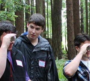 Arcata High School students measure tree height using a clinometer. Your support enabled them and others to explore forest stewardship careers. Photo by The Forest Foundation