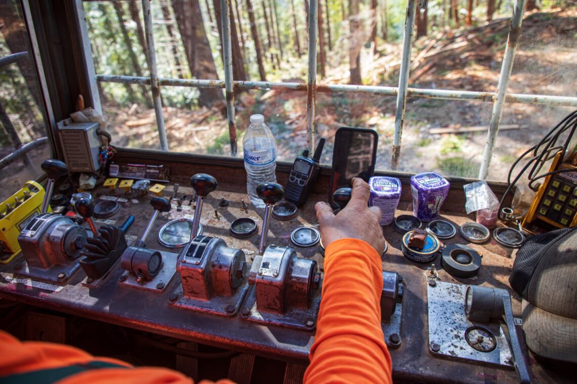 View from the POV of a forestry machine operator with a restoration thinning crew as he changes gears